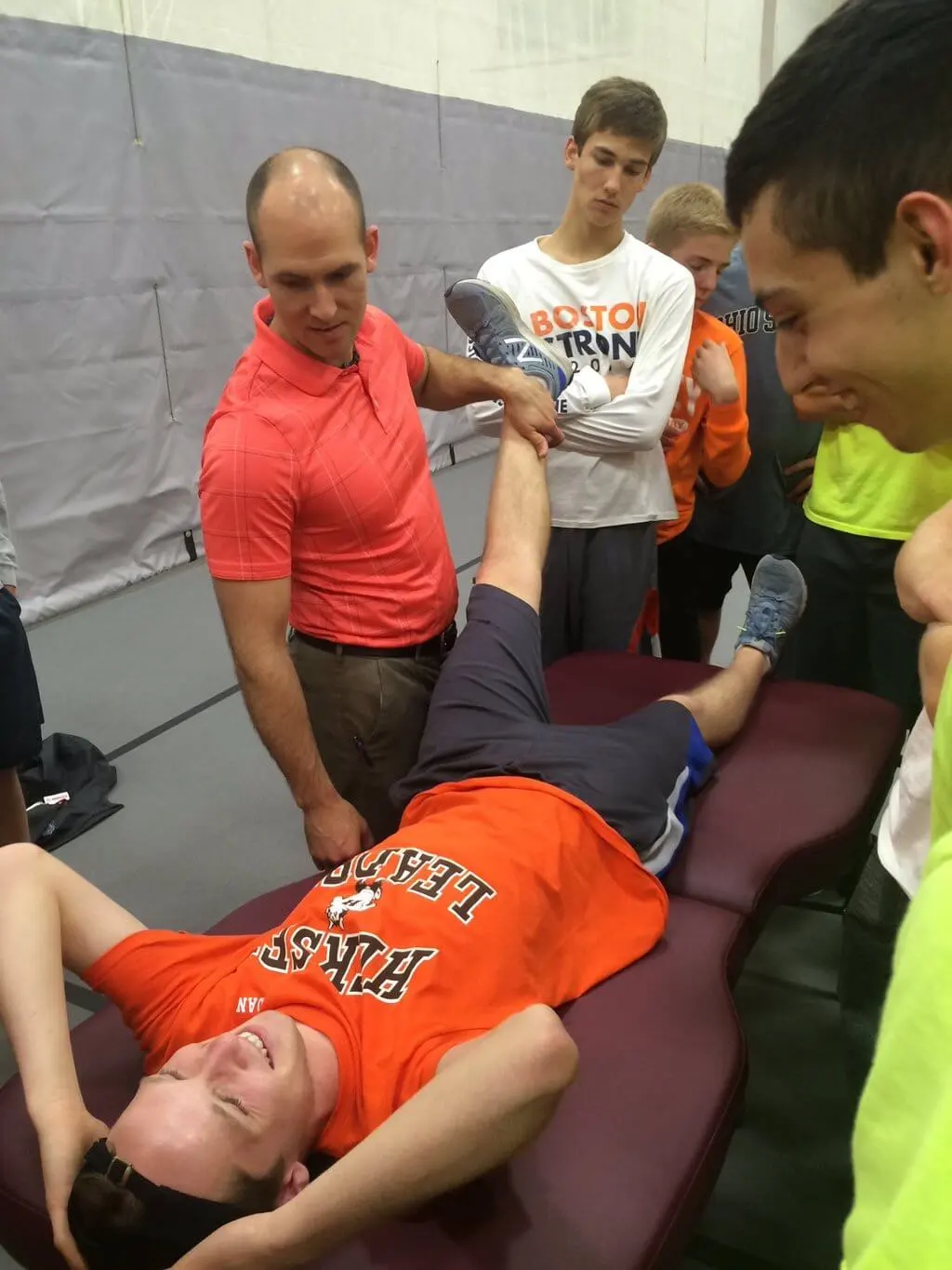 Dr. Nate Porcher performing chiropractic treatment at a shcool